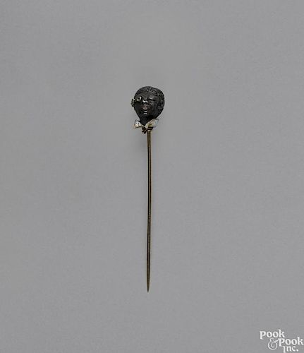 Blackamoor gold, enamel, and bronze stick pin, 19th c., the head with a diamond monocle, 2 3/4'' l.