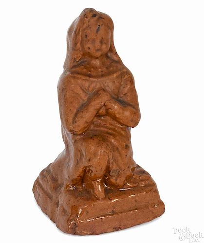 Redware figure of a kneeling woman, 19th c., probably Pennsylvania, 4'' h. Provenance: Titus Geesey