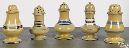 Five mocha yelloware pepper pots, 19th c., with banded decoration, 4 1/4'' h.