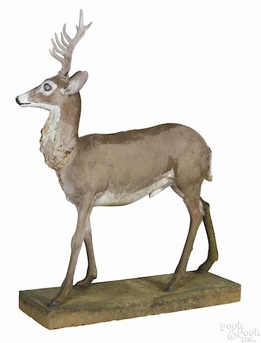 Pair of cast iron deer lawn or garden statues, late 19th c., of a stag, 62'' h., and a doe, 47'' h.