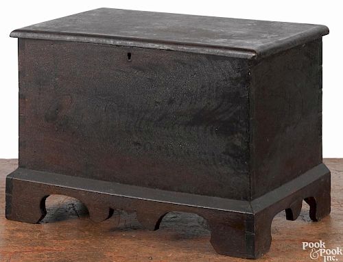 Miniature Pennsylvania walnut blanket chest, 19th c., with a scalloped apron