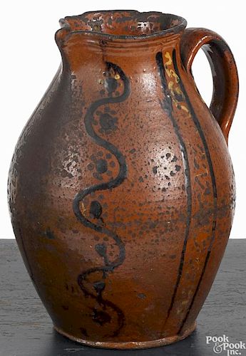 Alamance County, North Carolina redware pitcher, ca. 1800, with yellow and brown slip decoration
