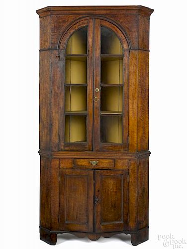 Pennsylvania curly maple two-part corner cupboard, early 19th c., 83'' h., 39 1/2'' w.