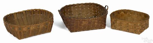 Three woodlands baskets, late 19th c., the smaller two with potato stamp decoration