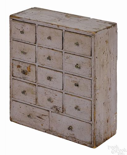 Painted pine table top apothecary cupboard, 19th c., retaining a later lavender surface, 22'' h.