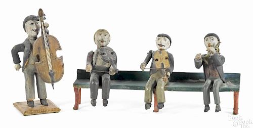 Folk art carved and painted musician group, late 19th c., featuring a standing figure