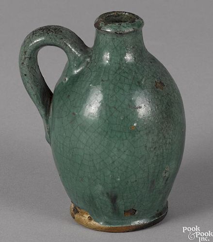 Miniature redware jug, 19th c., probably southern, with unusual turquoise glaze, 4'' h.