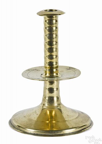 Large English brass trumpet candlestick, 17th c., with mid-drip, 8 1/2'' h.