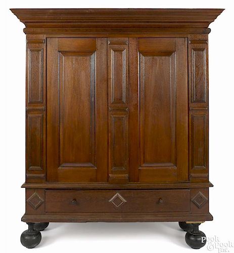 Hudson Valley walnut kas, ca. 1770, with a removable cornice and bun feet, 76'' h., 58'' w.