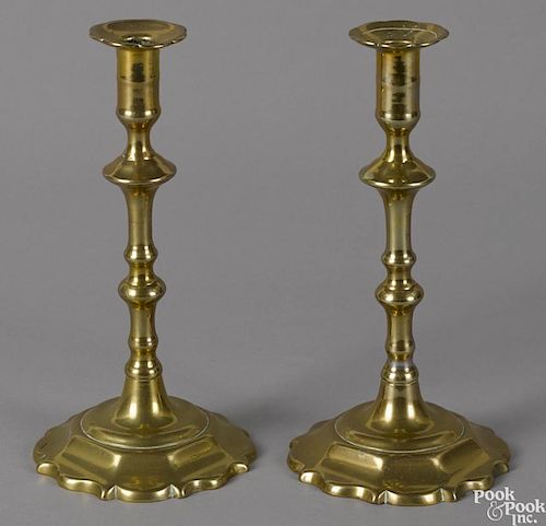 Pair of Queen Anne brass scalloped base candlesticks, ca. 1770, 9 3/4'' h.