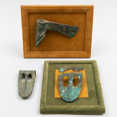 Two Framed Luristan Bronze Axe Heads and another Luristan Bronze Axe Head