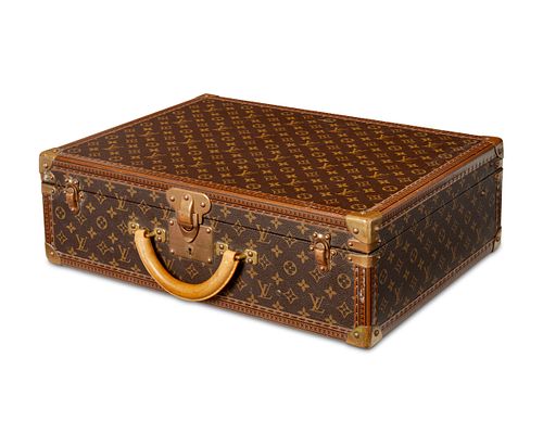 A vintage Louis Vuitton Bisten 55 Monogram suitcase