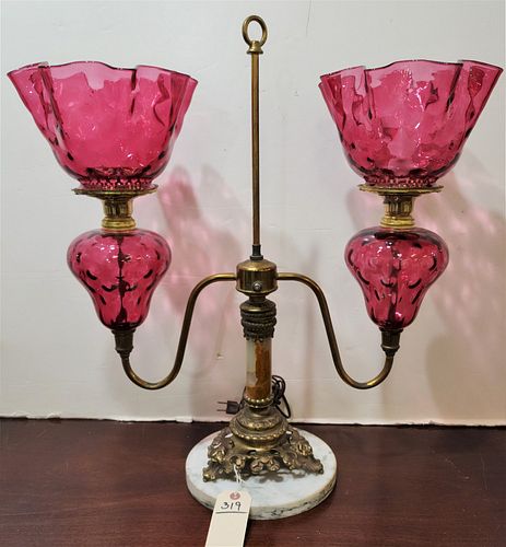 BRASS DOUBLE STUDENT LAMP W/CRANBERRY GLASS FONTS SHADES W/ALABASTER COLUMN MOUNT
