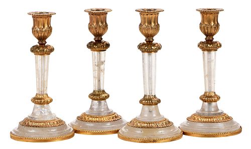 Four Neoclassical Rock Crystal and Gilt Bronze Candlesticks