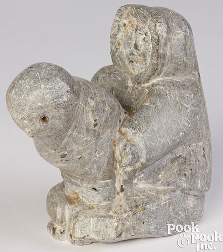 Eskimo carved stone figure of a man and seal