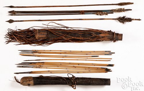 Two African hide quivers with arrows
