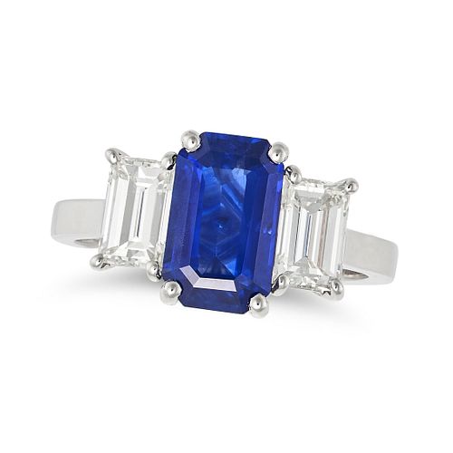 A SAPPHIRE AND DIAMOND THREE STONE RING in platinum, set with an octagonal step cut sapphire of 2...