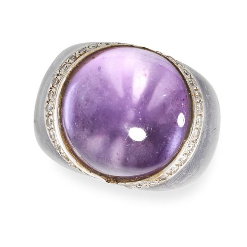 AN AMETHYST AND DIAMOND DRESS RING in 18ct white gold, set with a cabochon amethyst within a bord...