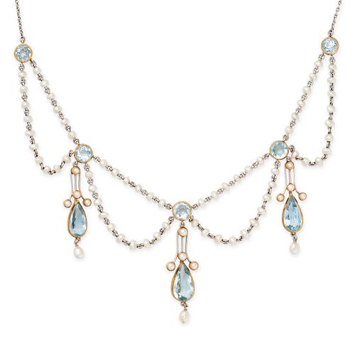 AN ANTIQUE EDWARDIAN AQUAMARINE AND PEARL FESTOON NECKLACE in platinum and 18ct yellow gold, set ...