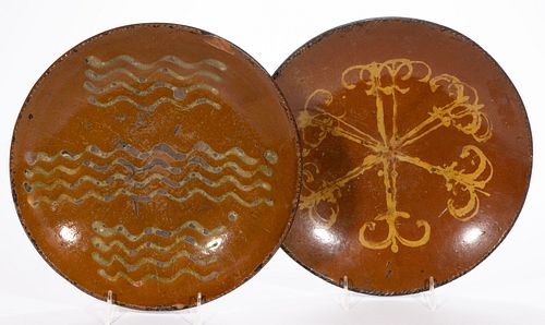 AMERICAN DECORATED EARTHENWARE / REDWARE CHARGERS, LOT OF TWO