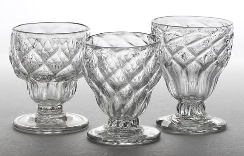PATTERN-MOLDED DIAMOND-QUILT GLASS FOOTED OPEN SALTS, LOT OF THREE
