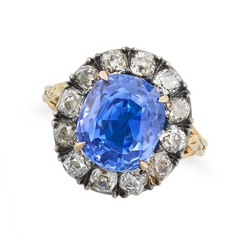 A BURMA NO HEAT SAPPHIRE AND DIAMOND CLUSTER RING in 18ct yellow gold and silver, set with a cush...