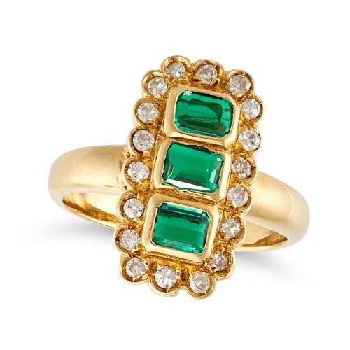 AN EMERALD AND DIAMOND DRESS RING in 18ct yellow gold, set with three octagonal step cut emeralds...