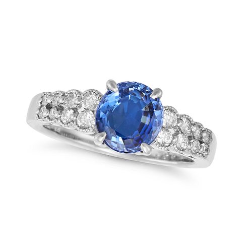 A SAPPHIRE AND DIAMOND RING in platinum, set with an oval cut sapphire of 2.04 carats on a bifurc...