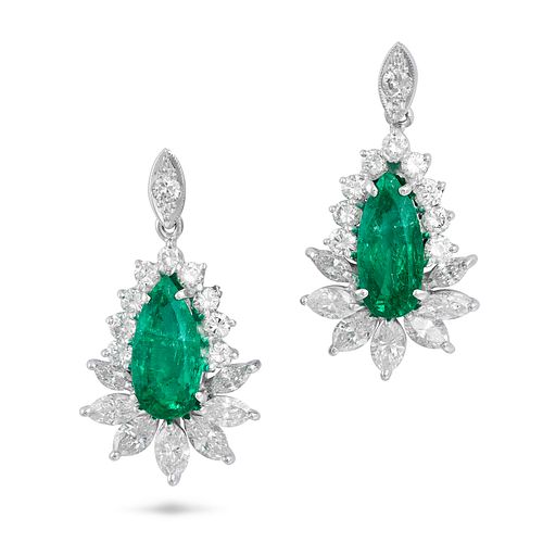 A PAIR OF EMERALD AND DIAMOND EARRINGS in platinum,Â each comprising a round cut diamond suspendin...