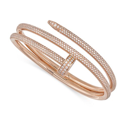 A DIAMOND NAIL BANGLE in 18ct rose gold, designed as a curved nail pave set with round brilliant ...