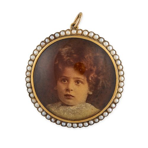 AN ANTIQUE MOURNING PORTRAIT MINIATURE AND PEARL PENDANT set with the photograph of a child in a ...