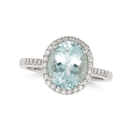 AN AQUAMARINE AND DIAMOND HALO RING in 18ct white gold, set with an oval cut aquamarine of 2.60 c...