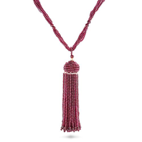 A GARNET BEAD AND PEARL SAUTOIR NECKLACE comprising five rows of garnet beads suspending a tassel...