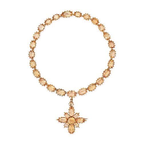 AN ANTIQUE IMPERIAL TOPAZ RIVIERE NECKLACE in high carat yellow gold, comprising a row of oval cu...