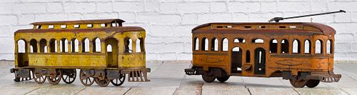 Two large painted tin trolley cars, 21 1/2'' l.