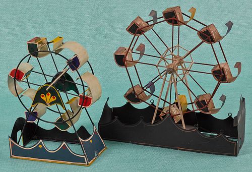 Two painted tin Ferris wheels, mid 20th c., one i