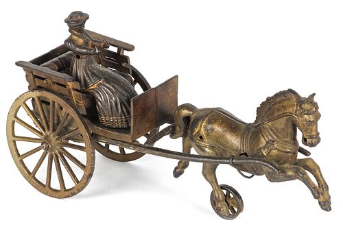 Shimer cast iron horse drawn cart with a woman dr