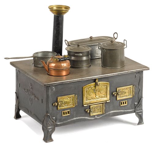 French tin and brass toy stove, 6 3/4'' h., 13 1/4