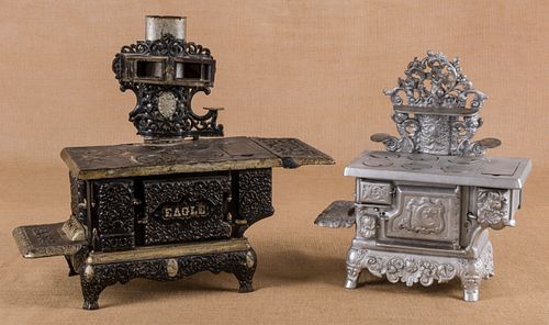Two cast iron toy stoves, to include a Lancaster