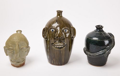 Three Pottery Face and Snake Jugs