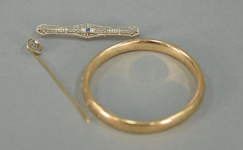 Three piece lot to include 18K bangle bracelet, 14K bar pin with blue sapphire and two diamonds, and a 14K stickpin. total we