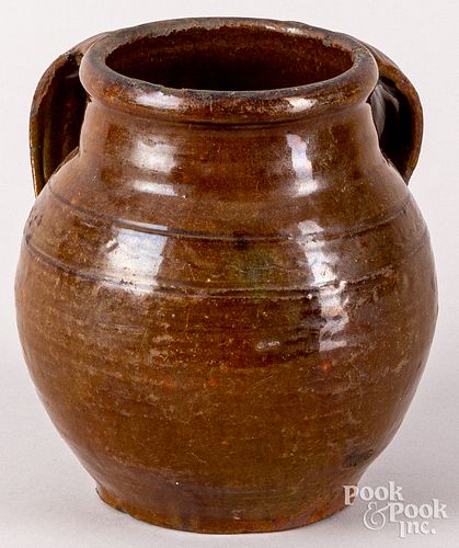 Unusual double handled redware jar, 19th c.