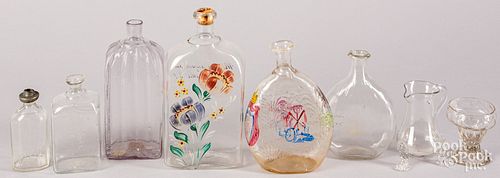 Group of colorless glass bottles and flasks