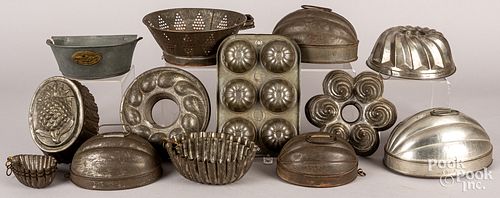 Collection of tin molds and kitchen accessories