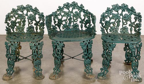 Three Victorian cast iron garden chairs