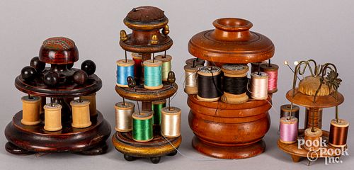 Four turned wood spool holders, 19th c.