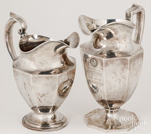 Two sterling silver water pitchers