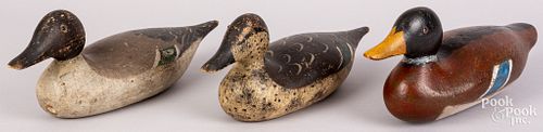 Three carved and painted duck decoys, mid 20th c.
