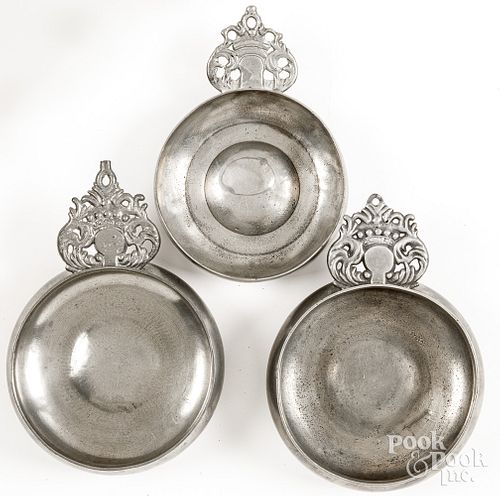 Three crown handled pewter porringers