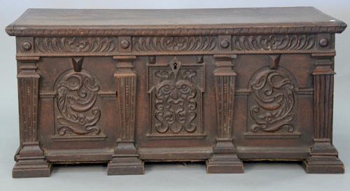 Carved Continental lift top chest.